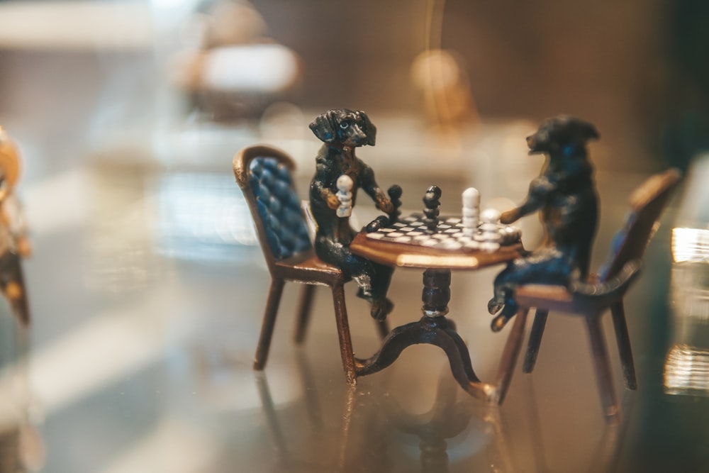 a miniature chess game set up on a table