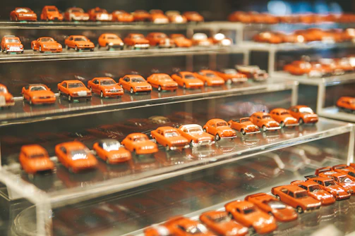 A display of various car accessories arranged neatly on minimalist black shelves