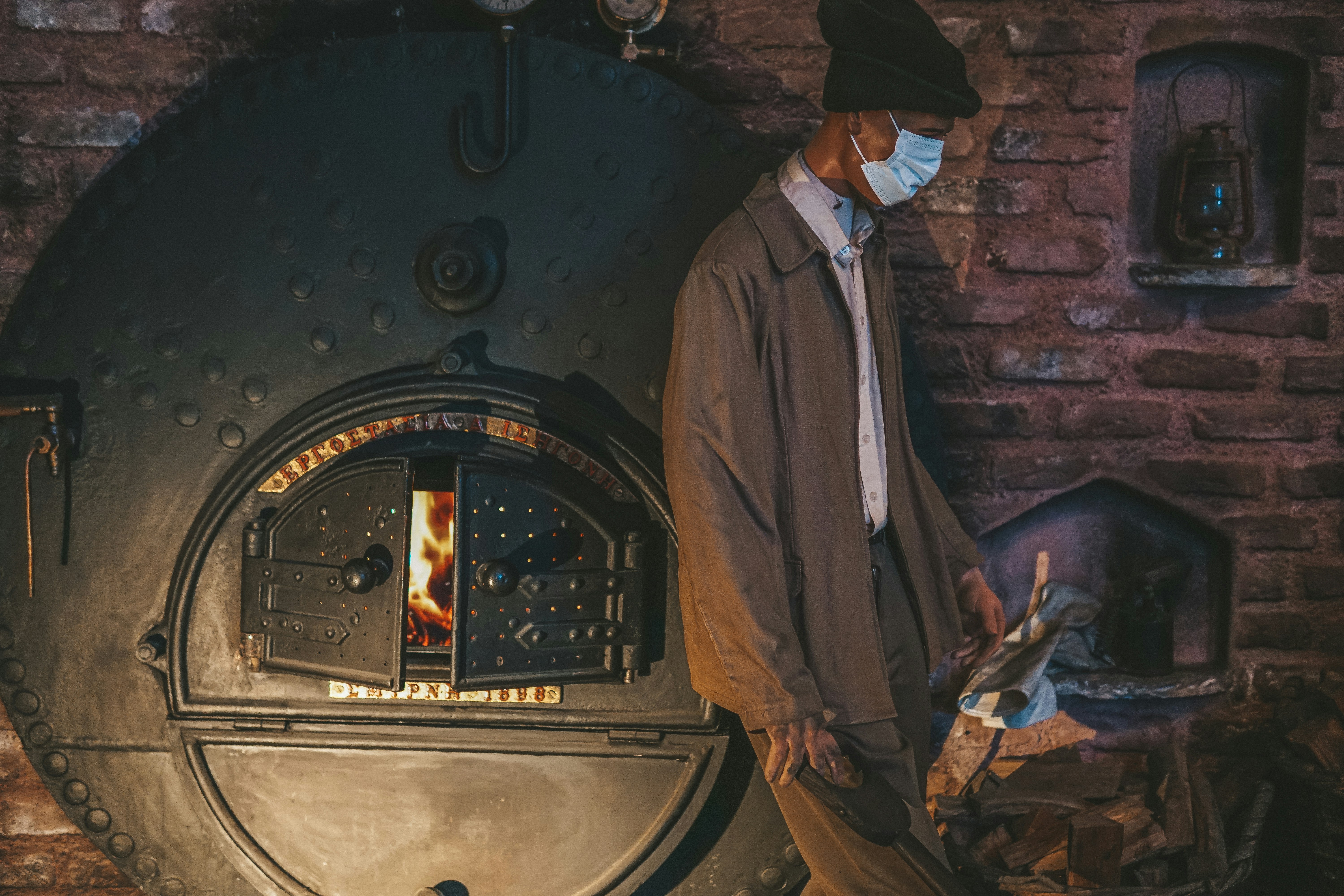 technician inspecting residential furnace during tune-up