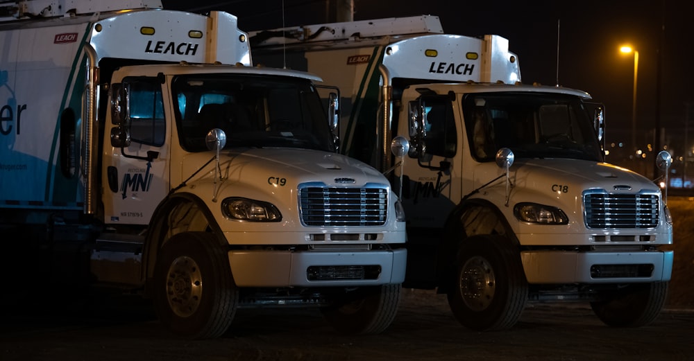 a couple of trucks parked next to each other