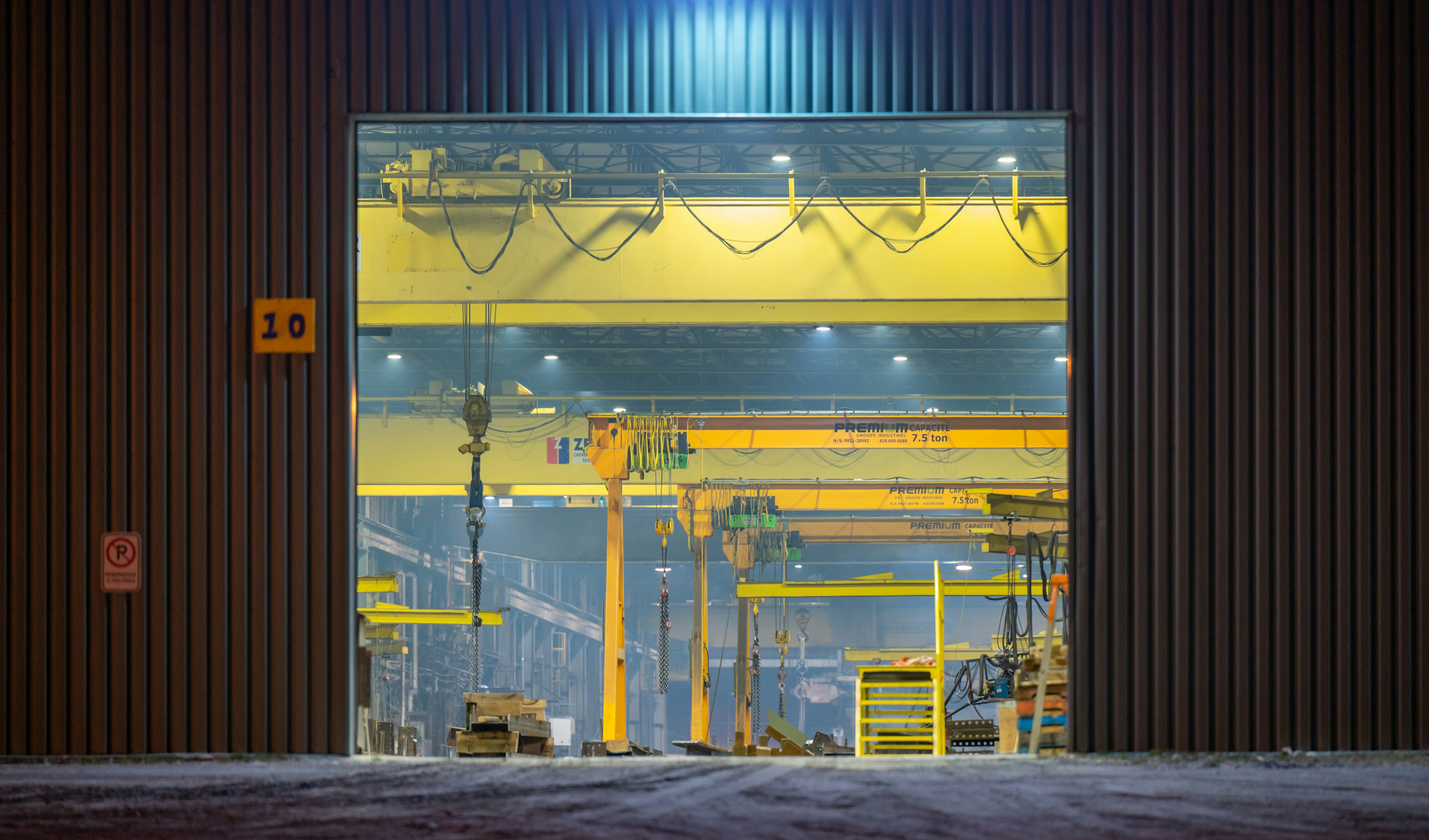 Industrial facility illuminated by round high bay led lights