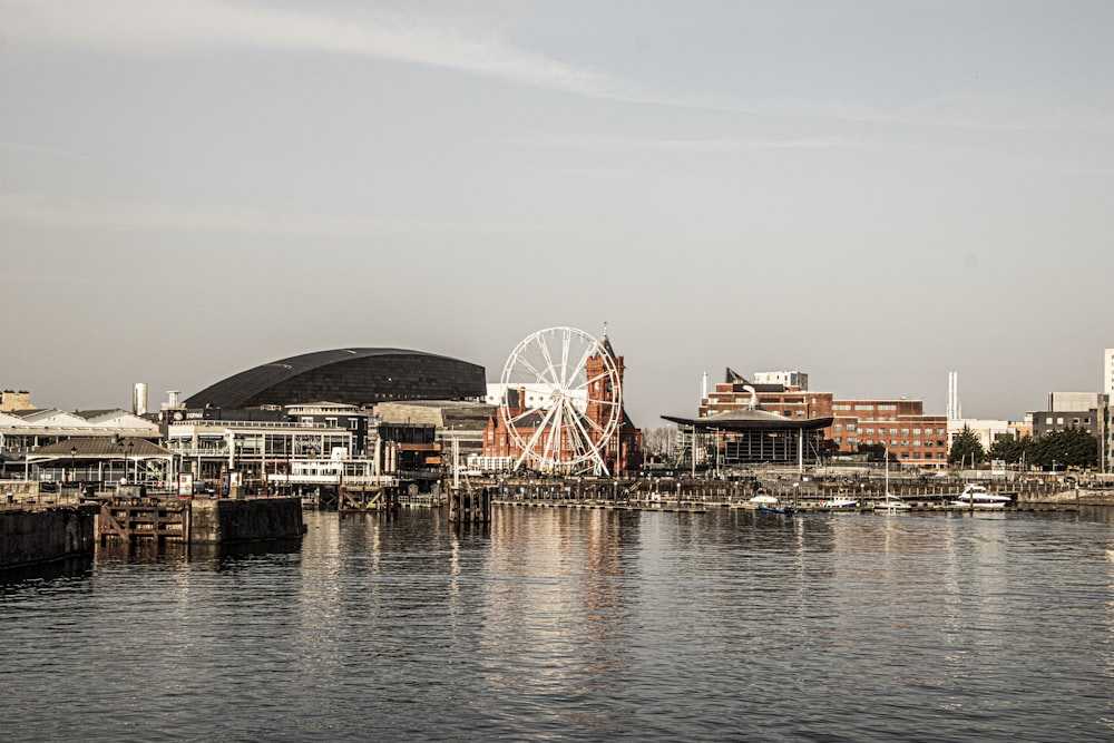 a large ferris wheel sitting in the middle of a body of water