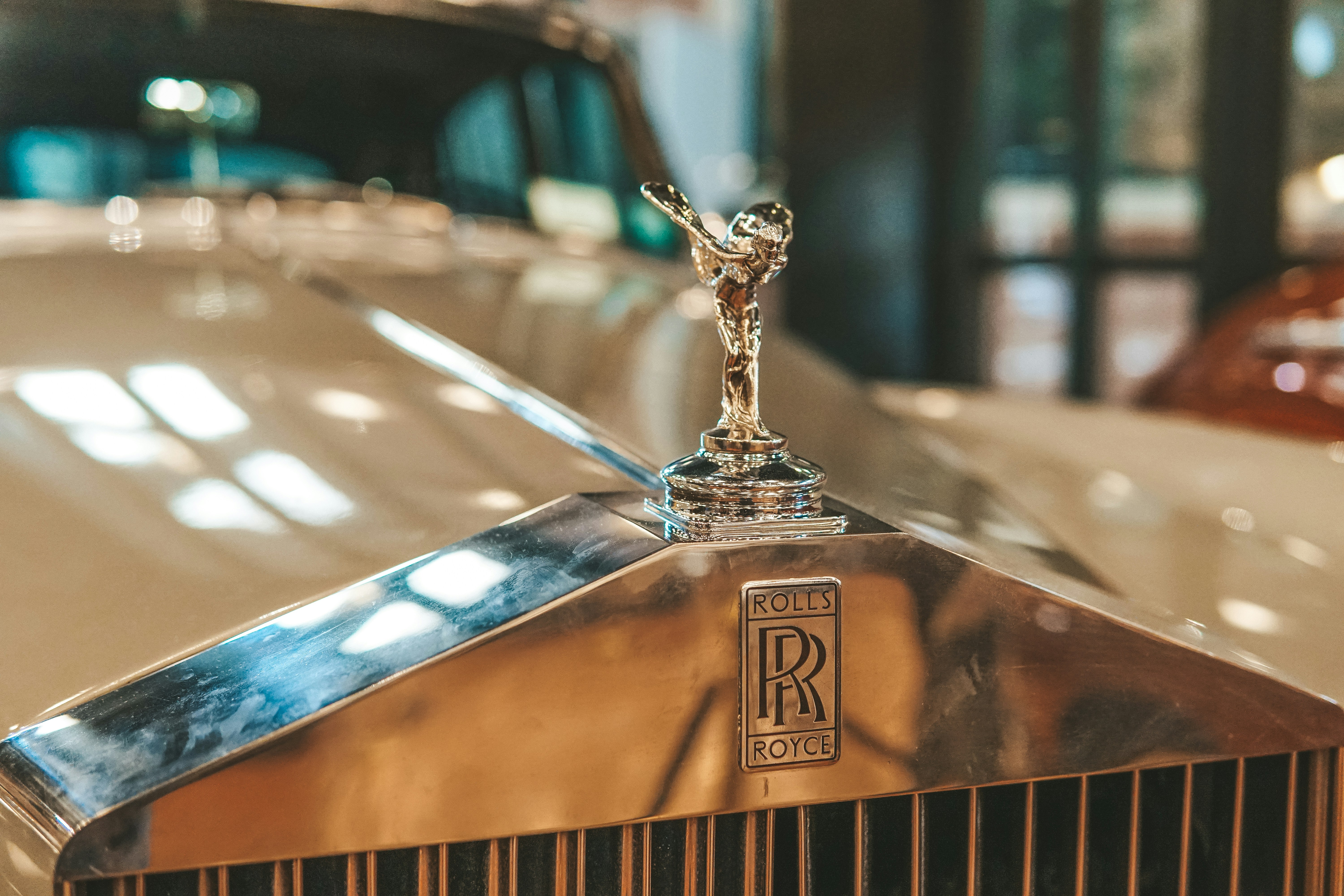 Close-up of a hood ornament on a classic car