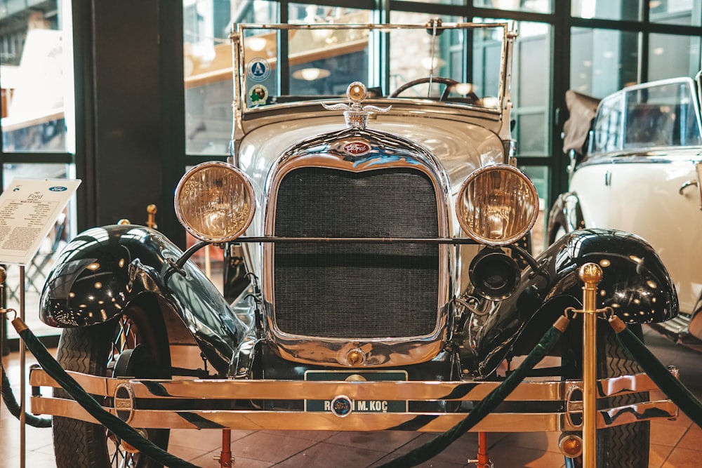 an antique car on display in a museum