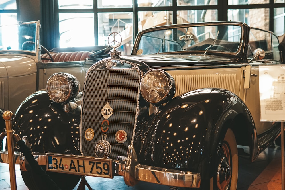 an antique car is on display in a museum