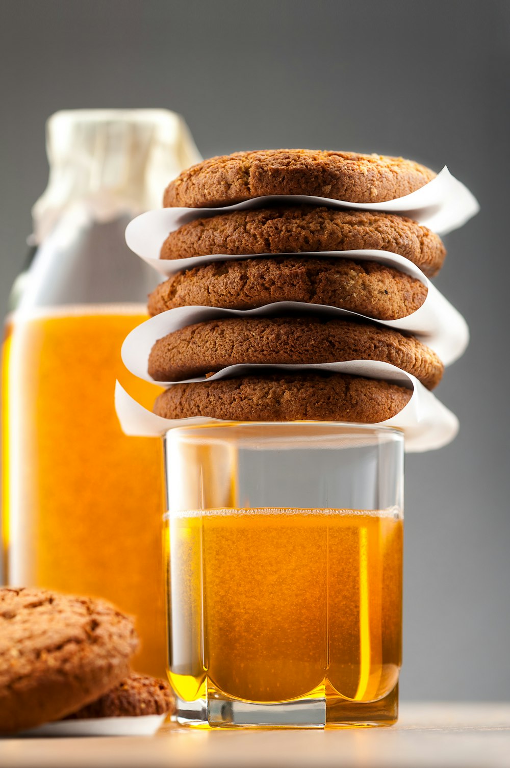 a stack of cookies sitting next to a glass of beer