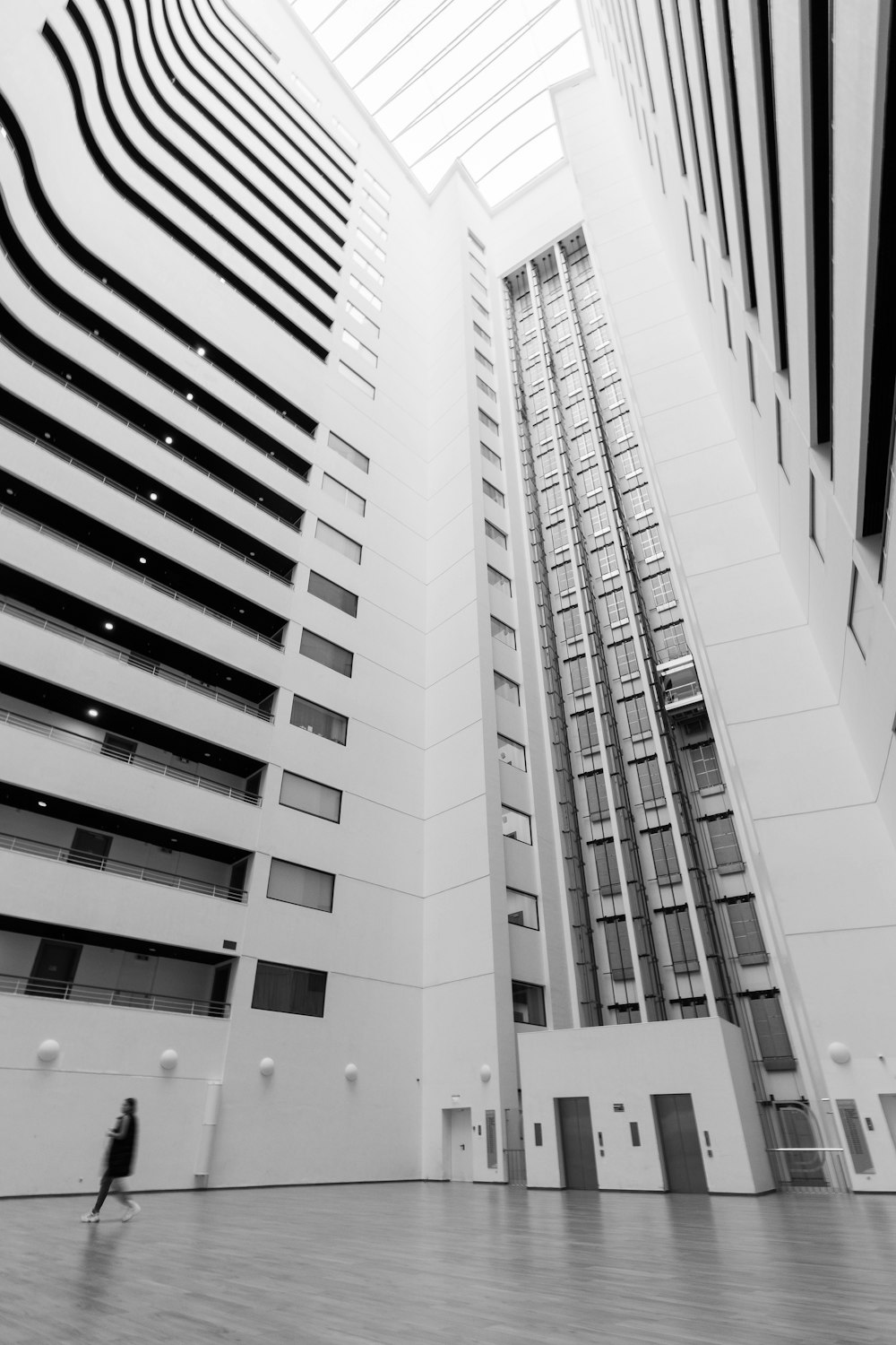 a black and white photo of two tall buildings