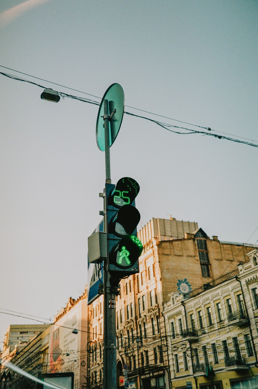 a traffic light sitting on the side of a road