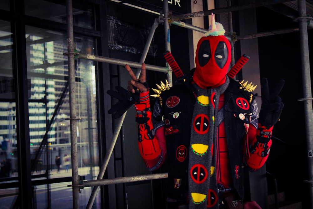 a man dressed in a deadpool costume