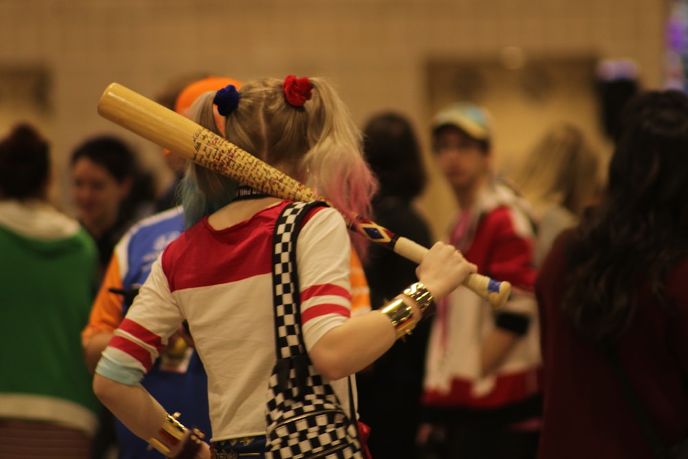 a woman with a baseball bat in her hand