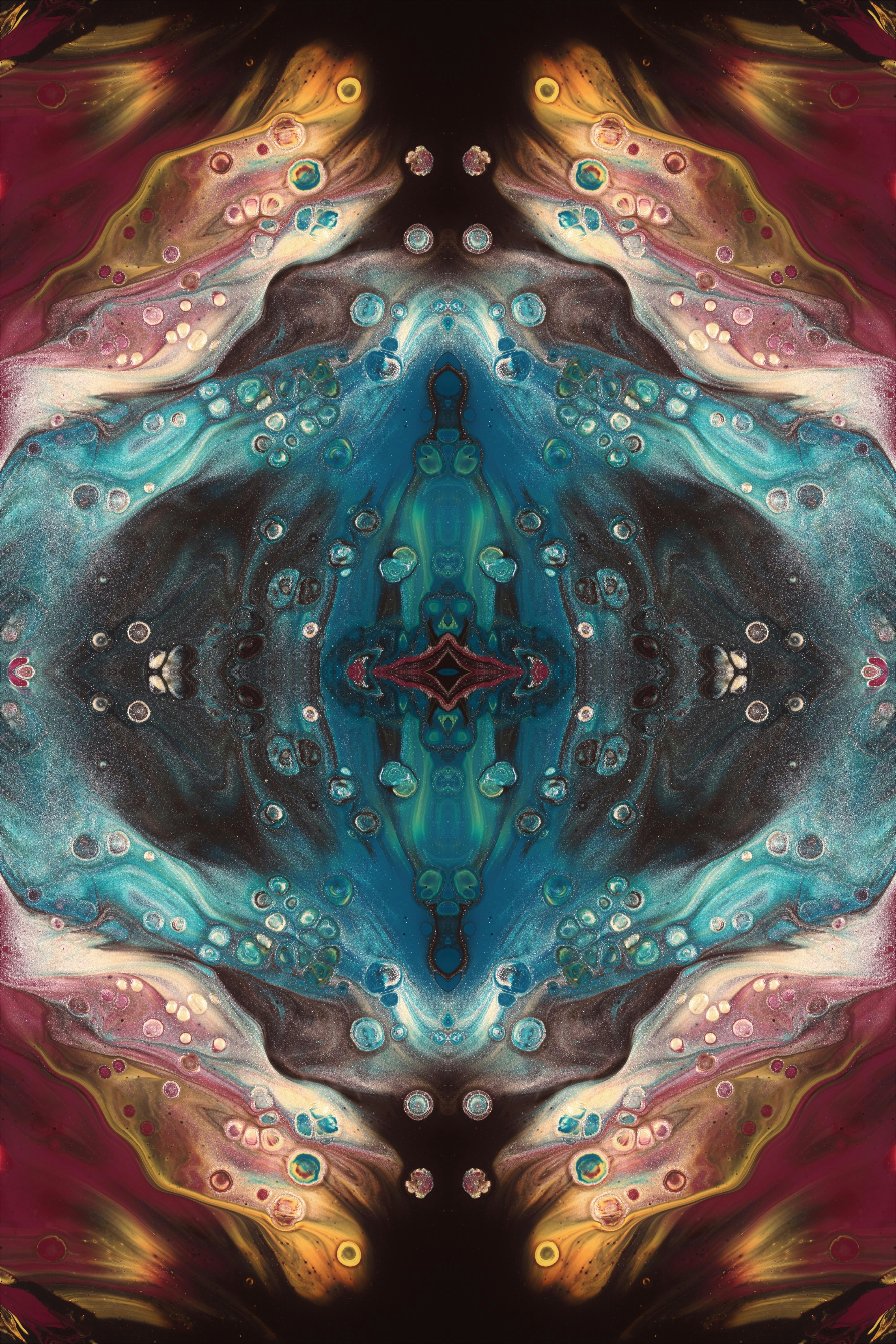 an abstract painting of a blue and red flower