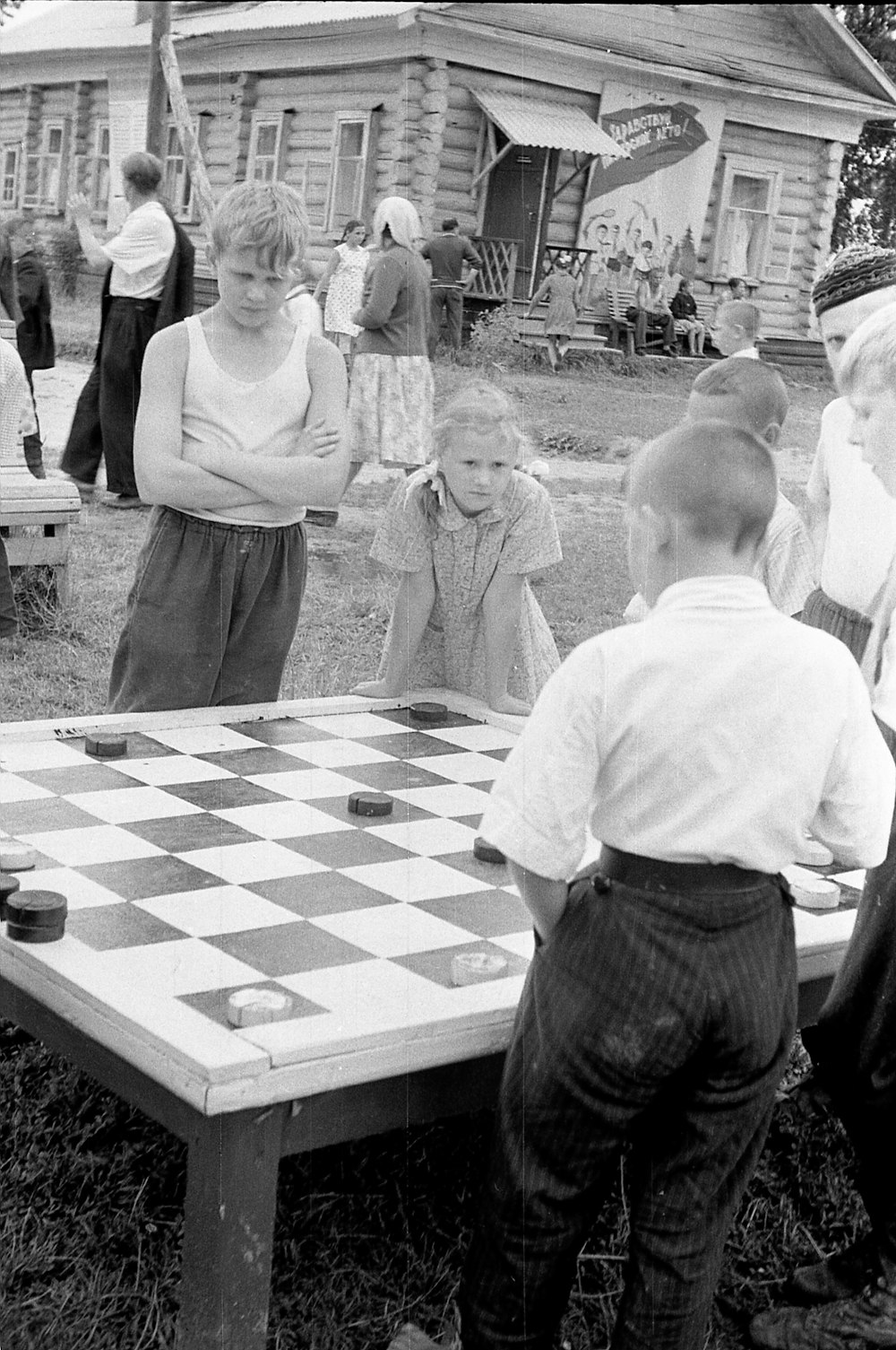 a group of people playing a game of chess
