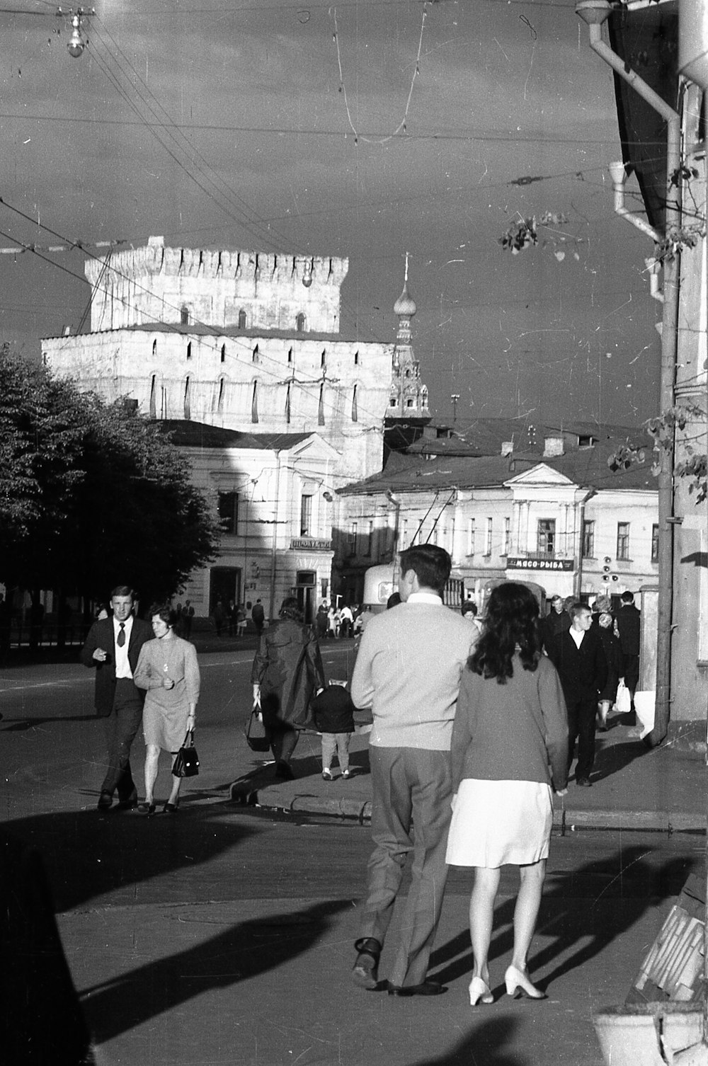 a group of people walking down a street