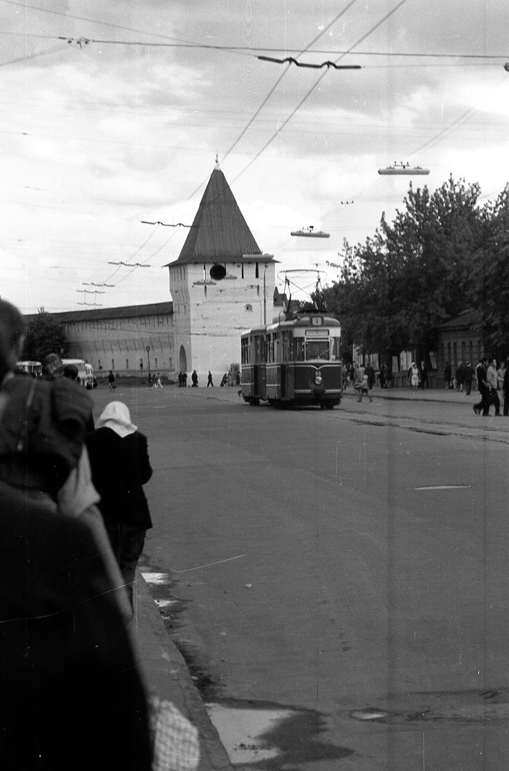 a man and a woman walking down the street