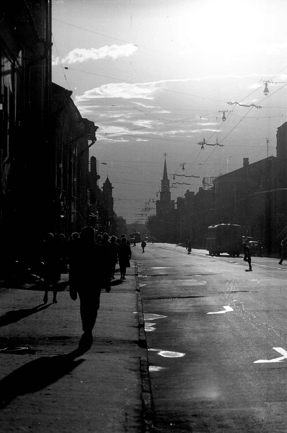 a group of people walking down the street