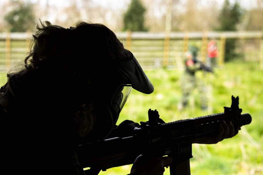 a person with a gun in their hand