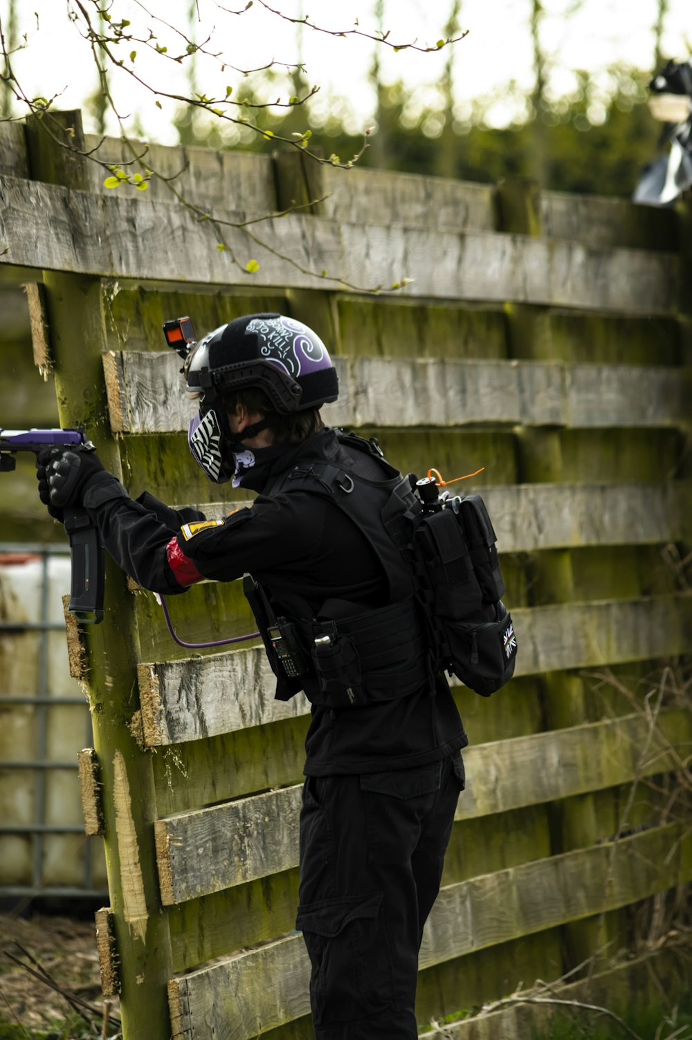 a person with a gun and a helmet on