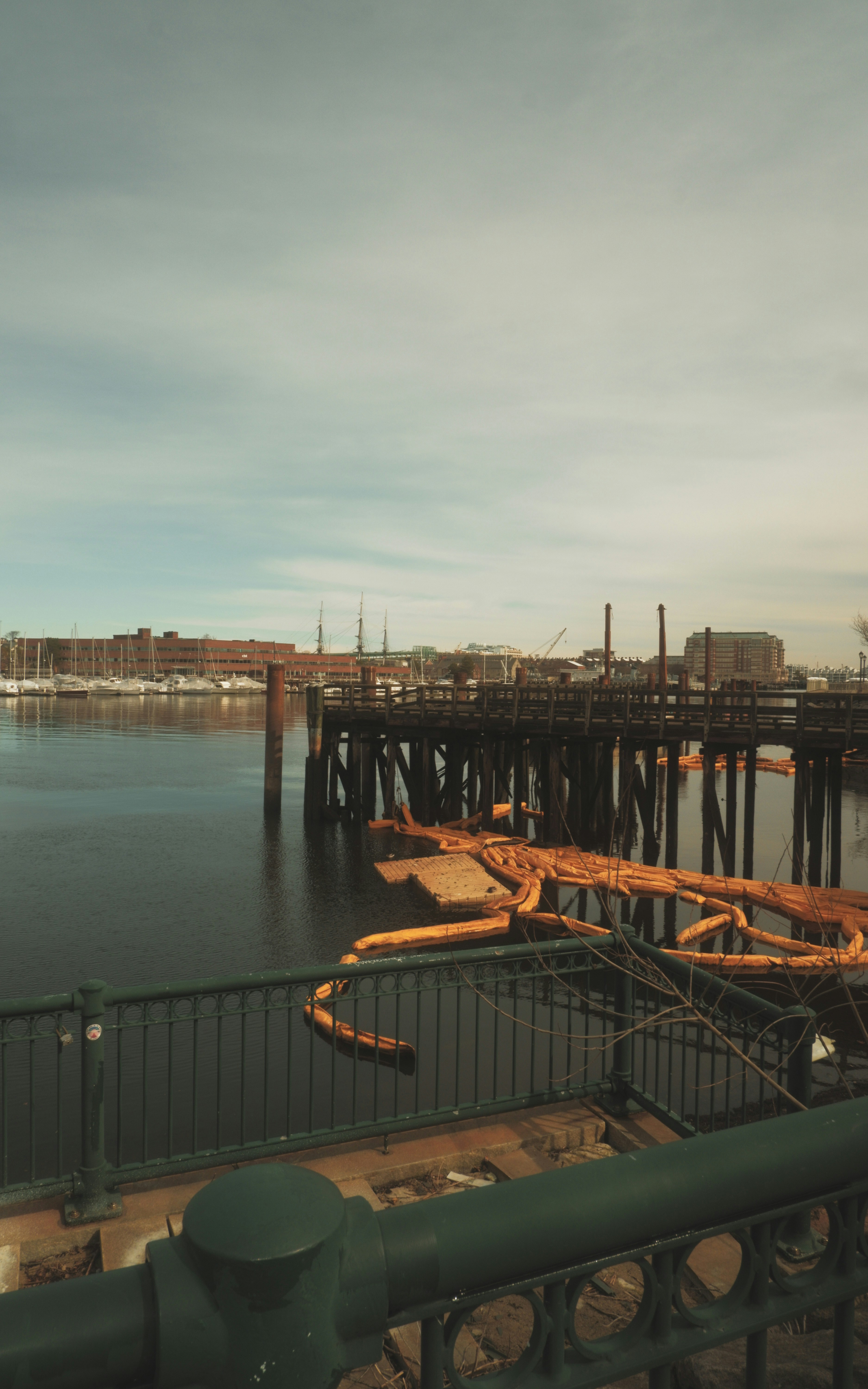 a large body of water with a bridge in the background