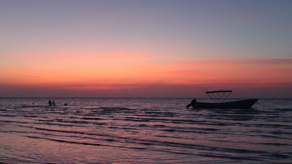 a boat sitting on top of a body of water