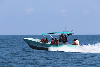 a group of people riding on the back of a boat