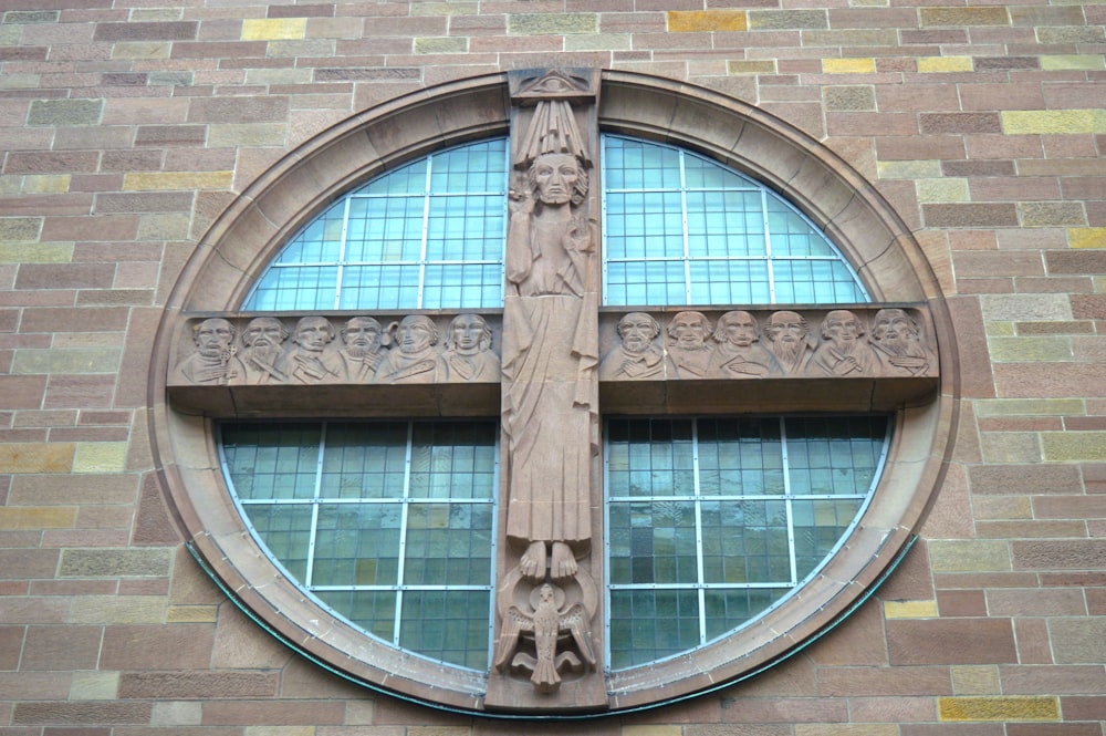 a large window with a cross on the side of it