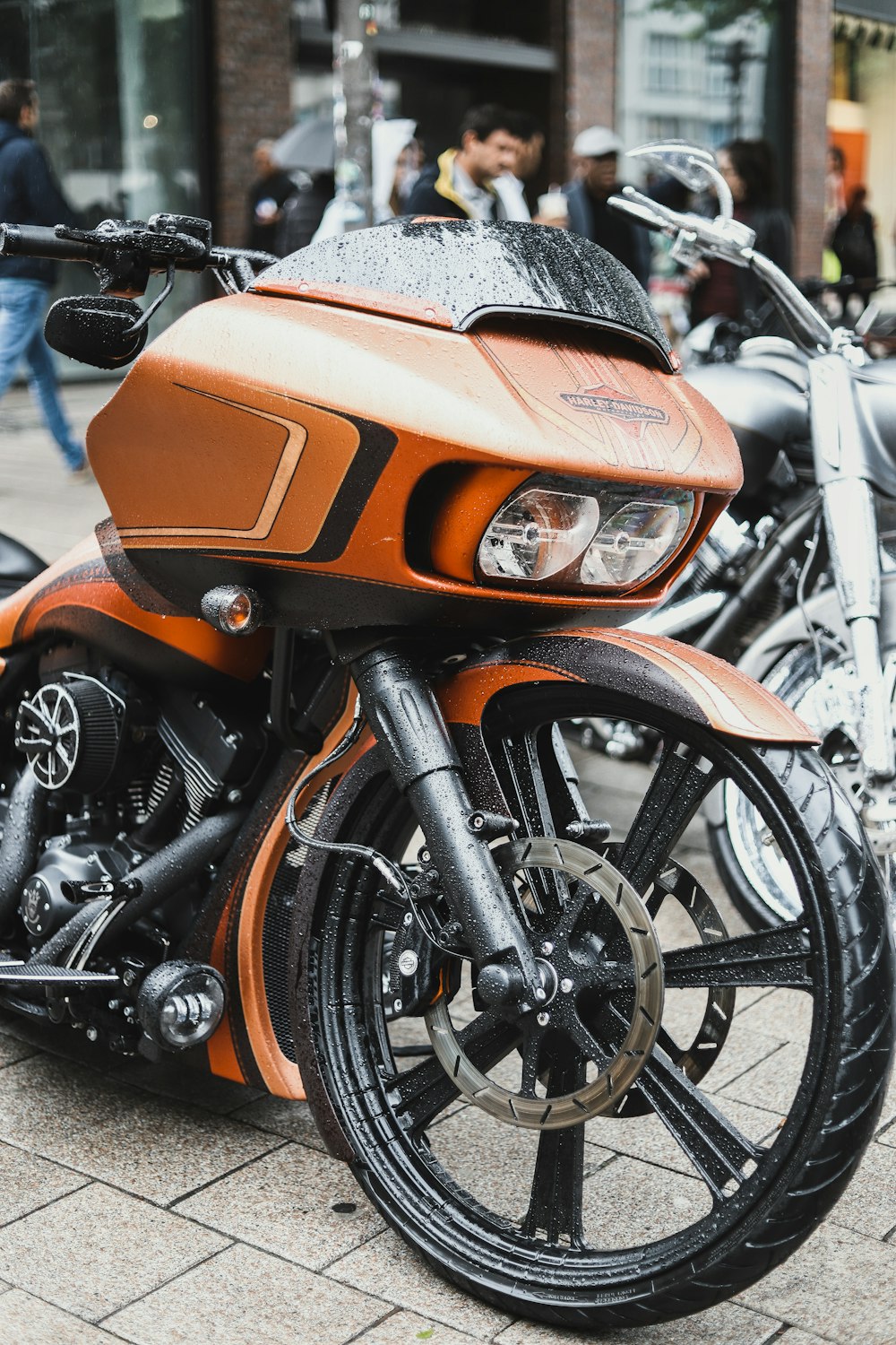 a close up of a parked motorcycle on a street