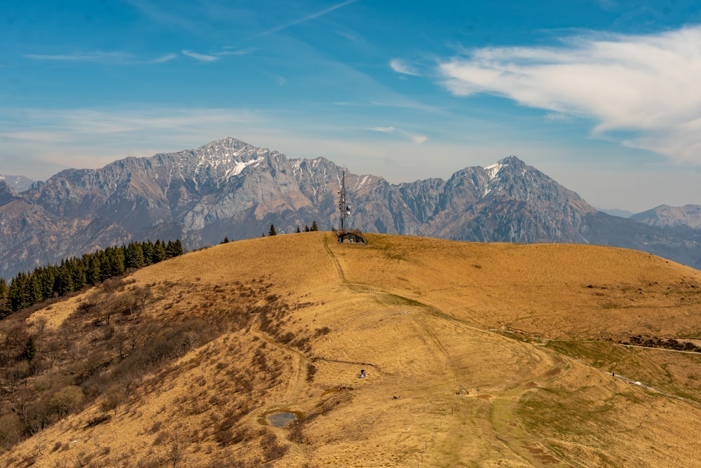 a view of the mountains from a hill top