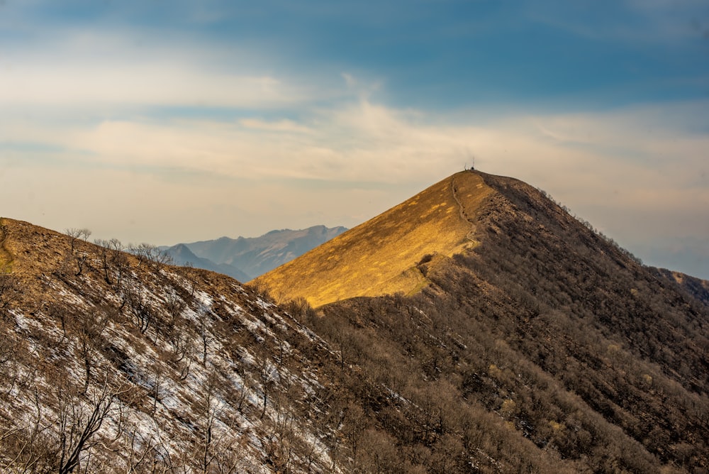 a view of a mountain with snow on the ground