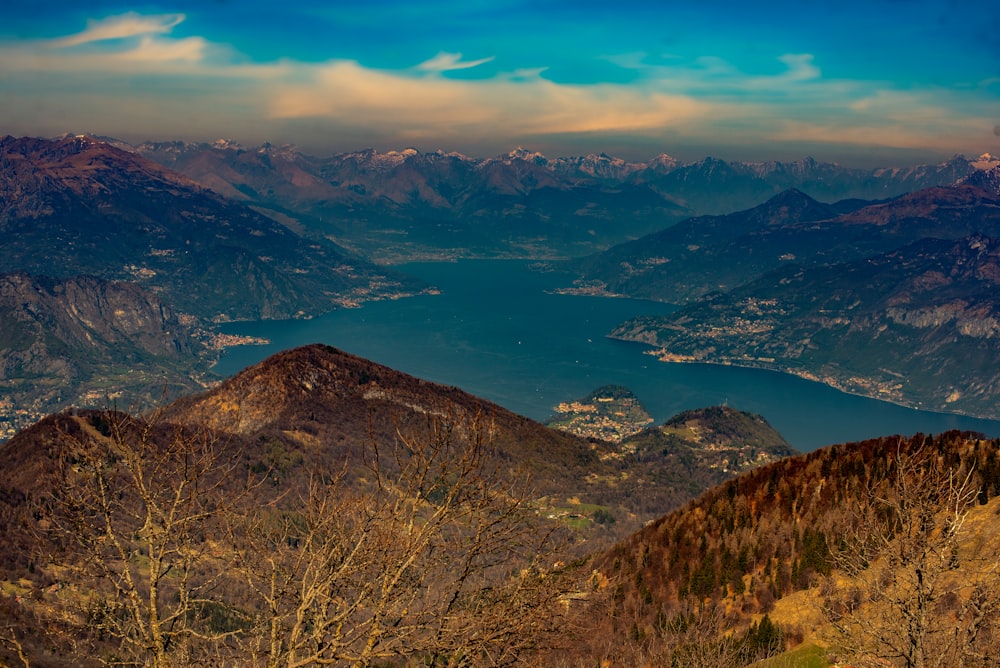 a view of a mountain range with a body of water in the distance