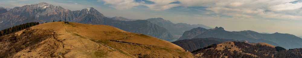 a group of mountains with a sky background