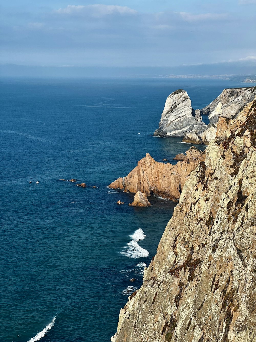 a view of the ocean from a cliff