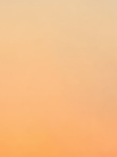 Subtle gradients blending warm whites into soft sands, with delicate shadow play that invites peaceful reflection.