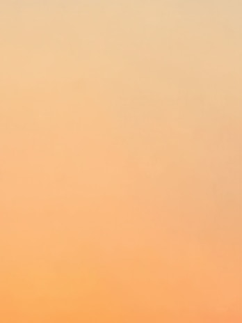 Subtle gradients blending warm whites into soft sands, with delicate shadow play that invites peaceful reflection.