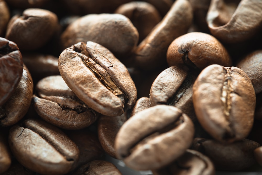 a pile of coffee beans sitting on top of each other