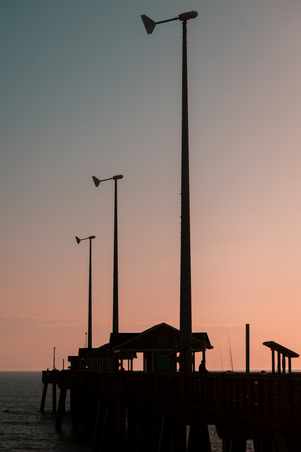 a pier with a light pole next to it
