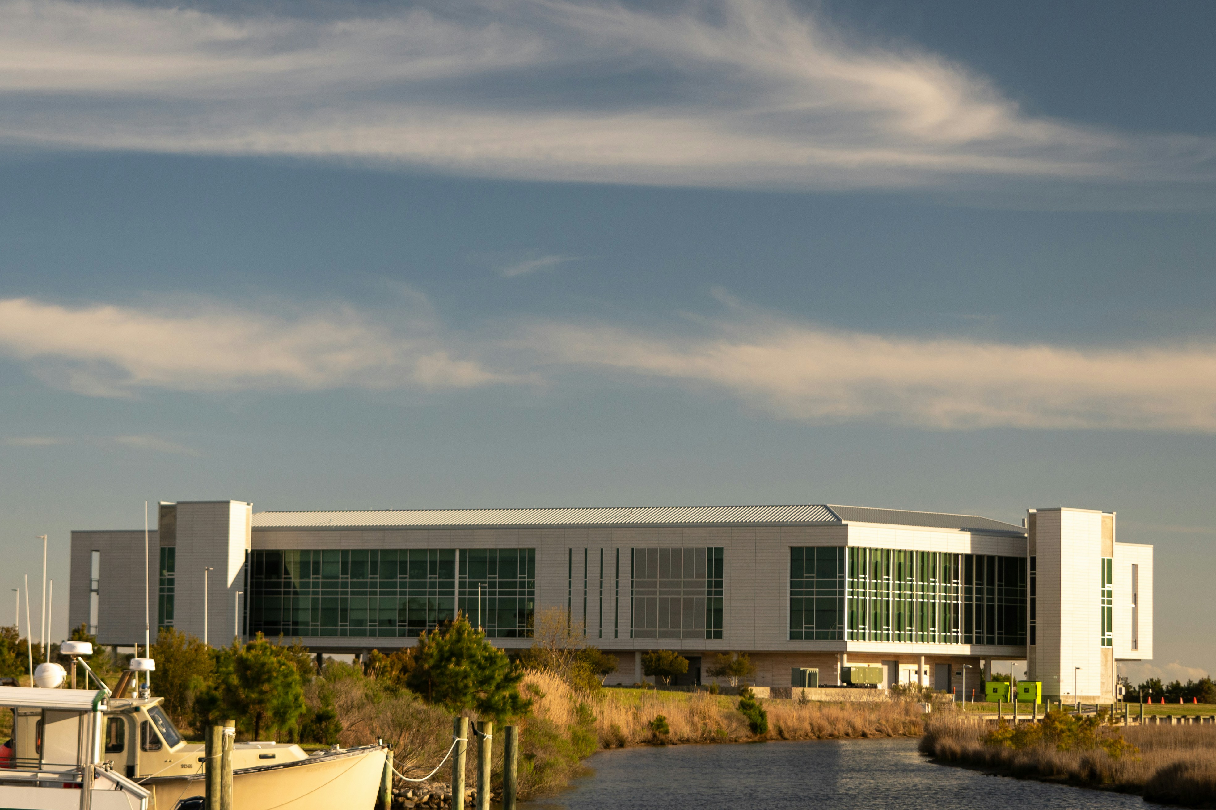 a large building sitting next to a body of water