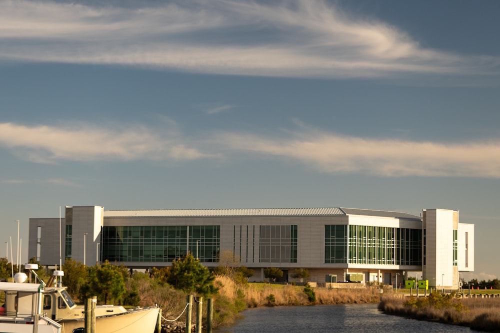 a large building sitting next to a body of water