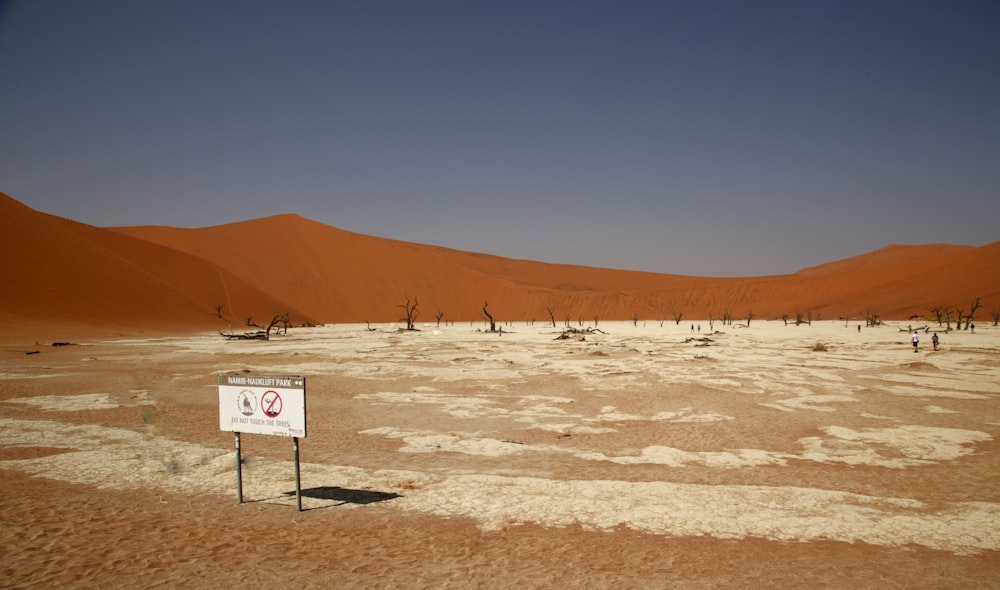 a sign in the middle of a desert