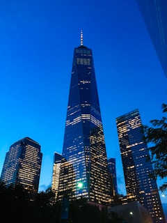 A stunning twilight view of Leviz Developers' high-rise tower glowing against the night sky.
