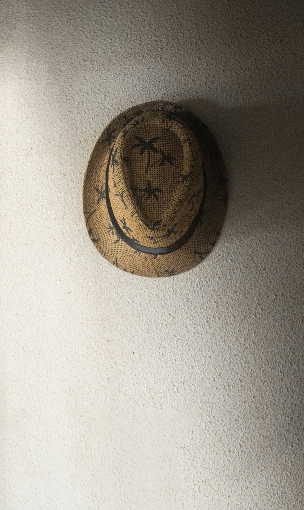 a hat hanging on a wall in a room