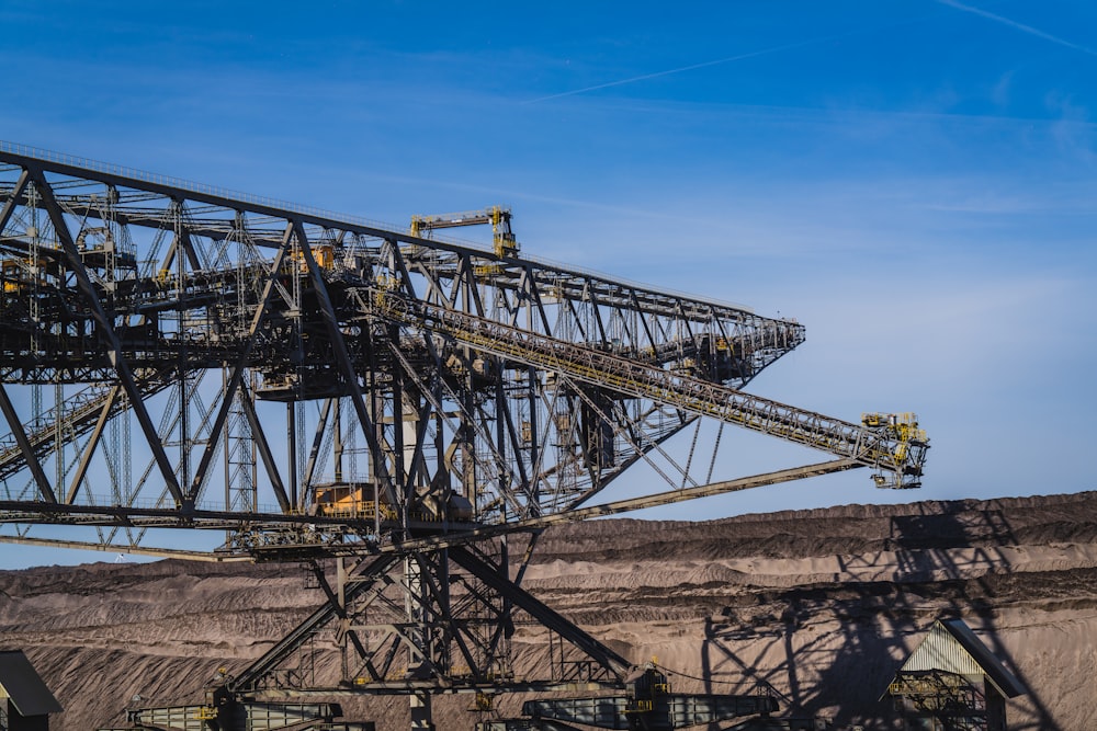 a large metal structure sitting in the middle of a desert