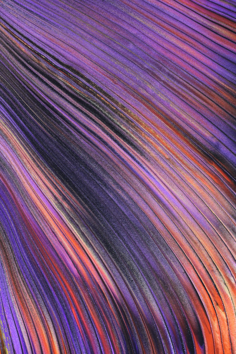 a close up of a purple and orange striped material