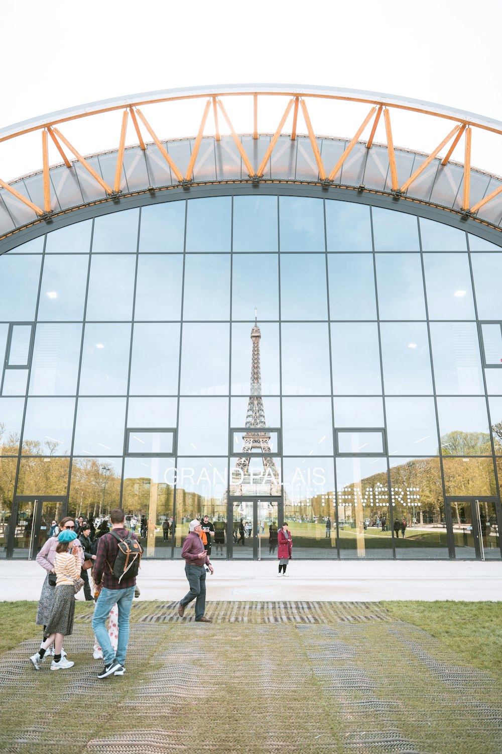 a group of people standing in front of a building