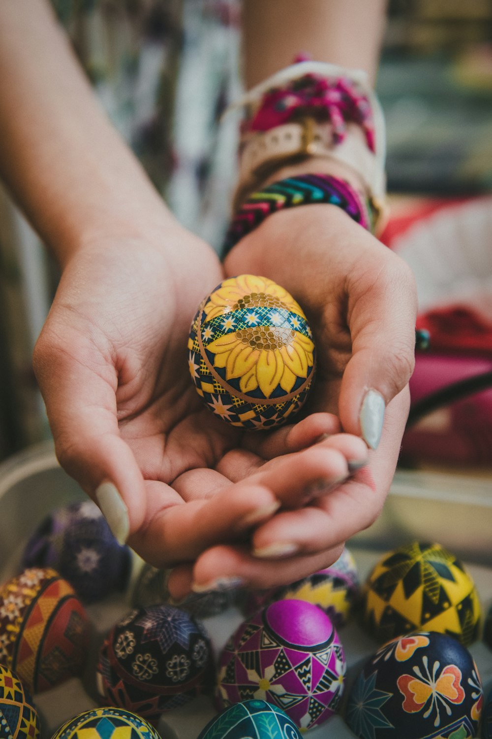 a person holding an egg in their hands