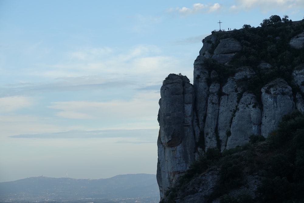 a mountain with a cross on top of it