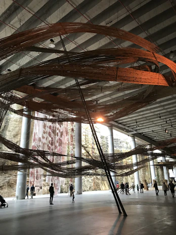 A panoramic view of a sophisticated installation bathed in natural light during Milan Design Week.