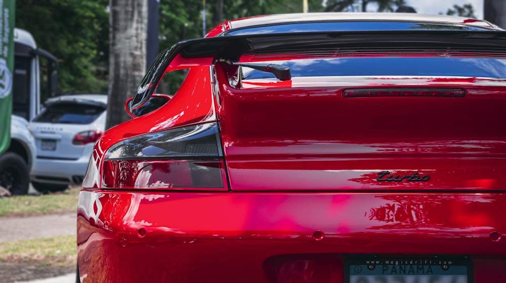 a red car parked on the side of the road