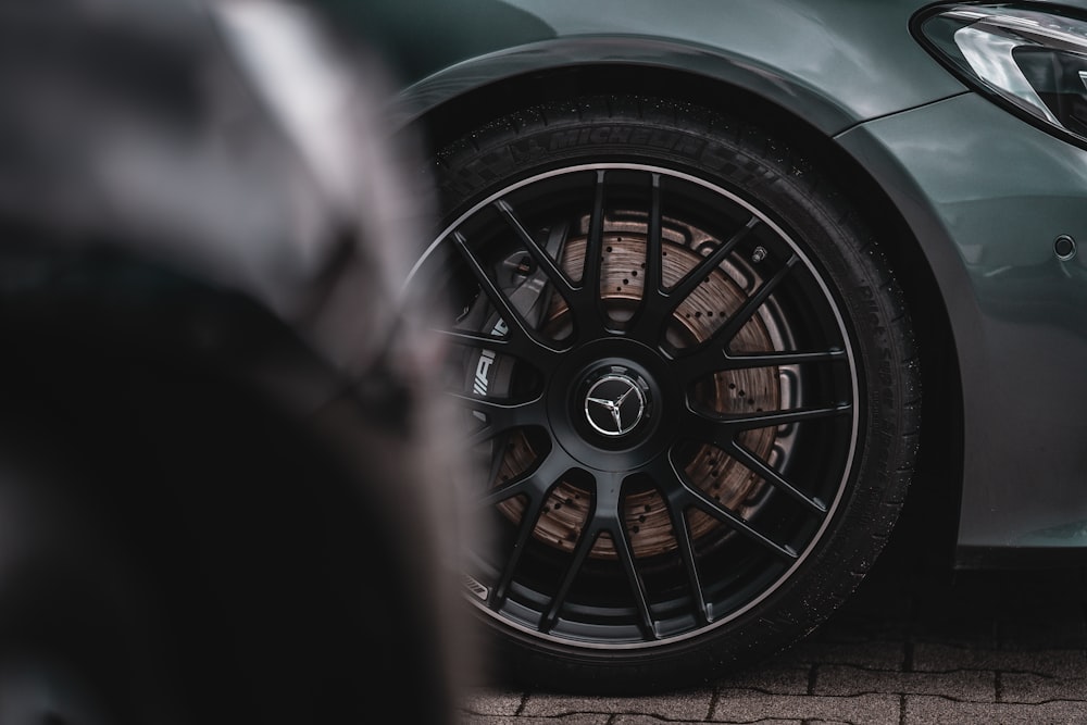 a close up of a car wheel on a street