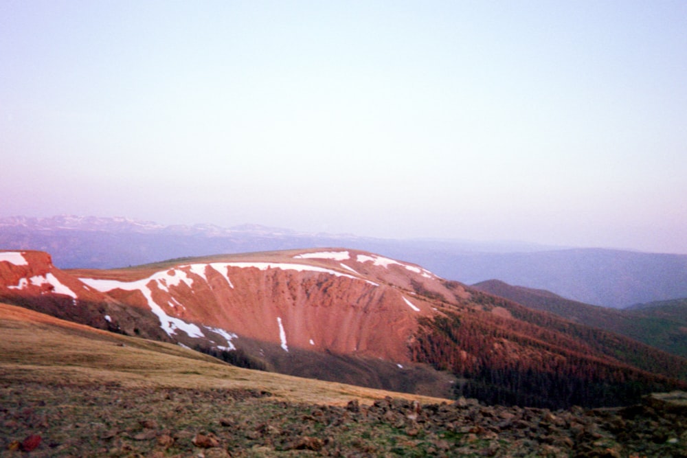a view of a mountain with snow on it
