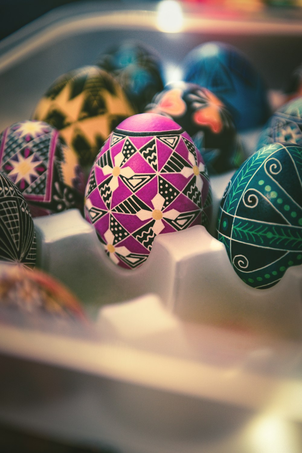 a close up of a bunch of decorated eggs